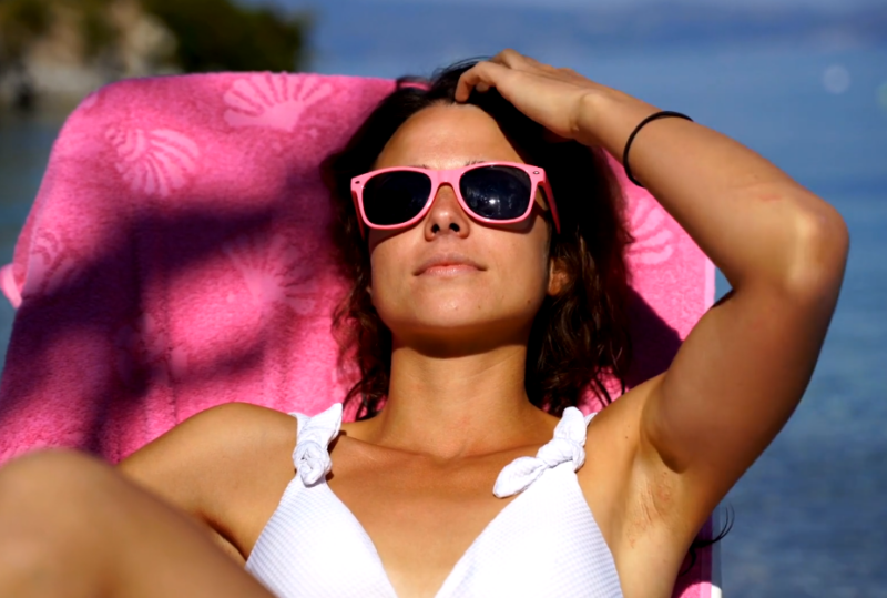 Woman sunbathing on the beach